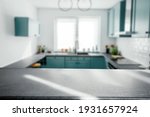 Blurred modern kitchen interior and desk space and outstanding furniture. 