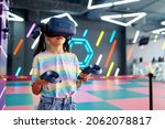Little girl in virtual reality glasses, playground