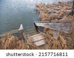 old wooden swimming ladder on Virlya lake closeup. Velyki Berezhtsi, Kremenets, Ternopil region, Ukraine.