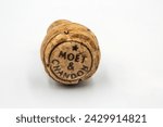 Small photo of Kyiv, Ukraine - June 18, 2022: Studio shoot of Moet and Chandon champagne bottle cork closeup on white. It is a French fine winery, part of the luxury goods company Moet Hennessy Louis Vuitton SE.