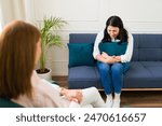 Woman psychologist listens...
