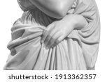 Closeup of white stone marble statue woman hand holding a tunic isolated on white background
