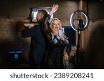 Small photo of Valmiera, Latvia - November 12, 2023 - Women and man stand in a 360 photo booth and dancing