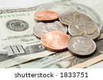 scattered coins atop a ten... | Shutterstock . vector #1833751