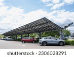 Small photo of CUIJK, NETHERLANDS - MAY 19 2023: Solar energy panels installed on the canopy of a car parking area in the Netherlands. Sustainable energy and shade at the same time