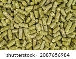 Small photo of Alfalfa pellet. Food background .Close up