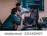 Small photo of Programmers engrossed in deep collaboration, diligently working together to solve complex problems and develop innovative mobile applications with seamless functionality.