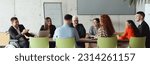 Small photo of Wide crop photo of a diverse group of business professionals, including an person with a disability, gathered at a modern office for a productive and inclusive meeting.