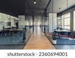 Small photo of In a setting of modern, glass-walled business startup offices, the open, airy workspace reflects a contemporary and innovative ambiance, promising a dynamic environment for entrepreneurial growth