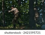 Small photo of A specialized military antiterrorist unit conducts a covert operation in dense, hazardous woodland, demonstrating precision, discipline, and strategic readiness