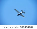 small retro airplane, clear blue sky in background