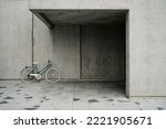 Bicycle parked near entrance of modern building