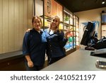 Small photo of SINGAPORE - NOVEMBER 06, 2023: two women posing at Birkenstock store inside Paragon Mall. The Paragon is a shopping complex located in the Orchard Road area of Singapore.