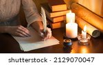 Small photo of Close up top view past god biblical law mail notice page pray read space. Closeup age male arm hold nib inkwell scribe draw art diary teach notepad card author human man boy dark black wood desk table