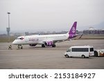 Small photo of Almaty, Kazakhstan - 03.16.2022 : The plane of the Mongolian airline Hunnu Air is parked at the airport site.