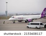 Small photo of Almaty, Kazakhstan - 03.16.2022 : The plane of the Mongolian airline Hunnu Air is parked at the airport site.