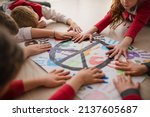 Small photo of Schoolchildren making poster of peace sign at school.