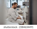 Small photo of Overweight patient in hospital gown waiting for medical examination, test results in hospital, feeling anxious. Patient feeling dizzy, have vertigo and intense pain.