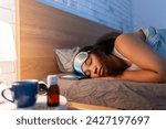 Small photo of Woman sleeping with sleep mask, using sleeping pills, melatonin. Concept of sleep routine. Insomnia a sleep problems among adults.