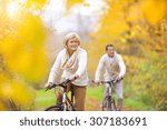 Active Seniors Riding Bikes In...
