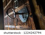 Big Key In Rustic Door Of...