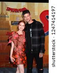 Small photo of LOS ANGELES - DEC 1: Madelaine Petsch, Travis Mills at the "Spider-Man: Into the Spider-Verse" Premiere at the Village Theater on December 1, 2018 in Westwood, CA