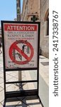 Small photo of Split, Croatia, 08 15 2023: Behavioral rules on a street signal in Spilt - Croatia