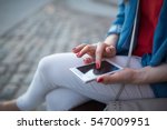Woman texting. Closeup young happy smiling cheerful beautiful woman girl looking at mobile cell phone reading sending sms isolated cityscape outdoor background.