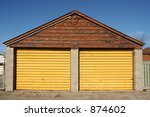 A Garage With Yellow Doors.