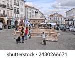 Small photo of EVORA, PORTUGAL - JUNE 3, 2018: People visit Giraldo Square (Praca do Giraldo) in Evora, Portugal. Evora is a UNESCO World Heritage Site.