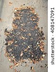 Small photo of Faulty road repair in Romania - fixed asphalt patch with dirt and leaves. Inept and ineffectual road work.