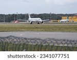 Small photo of Riga, Latvia - July 3, 2023: Avion Express Airbus A320-232 9H-AMK takes off from RIX International Airport.