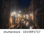 A misty night at Venice canal with historical buildings. Italy.