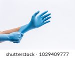 Human holding Variation of Latex Glove, Rubber glove manufacturing, human hand is wearing a medical glove, glove, isolated
