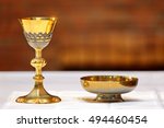 Golden chalice on the altar during the mass and place for text