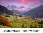 Autumn in Alps. Beautiful St. Magdalena village with magical Dolomites mountains in a gorgeous Val di Funes valley,  South Tyrol, Italian Alps at autumn sunset.