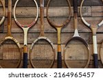 Old Fashioned Vintage and Broken Wooden Tennis Rackets or Racquets