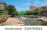 Small photo of Greenville, South Carolina USA - May 4, 2022: Downtown cityscape view of Falls Park on the Reedy in this charming southern town.