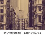 Street view in SoHo New York City with old historic buildings in sepia tone color