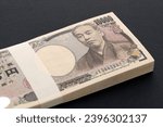Small photo of Japanese yen. 10,000 yen bundle of bills. The banknotes are written as "10,000 yen" in Japanese.