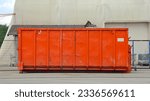 Small photo of Big Orange Roll Off Dumpster Industrial Waste Management