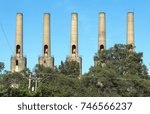 Small photo of ROSEMOUNT, MN/USA - JULY 26, 2016 - The five smokestacks at the Gopher Ordnance Works, a WW II-era munitions plant in Rosemount