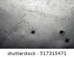 Worn metal background with bullet holes