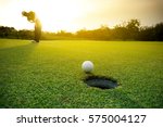 Golfer Putting Golf Ball On The ...