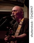 Small photo of BYRAM, NJ - MARCH 2: Graham Parker performs on the stage at SALT Gastropub on March 2, 2011 in Byram, NJ.