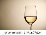 Wineglass With White Wine Over...