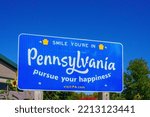 Small photo of Matamoras, PA, USA – October 11, 2022: A Smile Your In Pennsylvania Pursue Your Happiness sign at the Welcome Center in Matamoras.