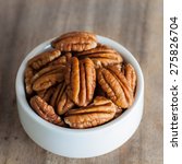 Pecan Nuts In Wood Bowl