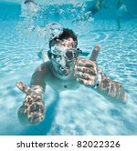 Man Floats Underwater In Pool