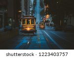 Magical twilight view of historic Cable Cars riding on famous California Street at dawn before sunrise, San Francisco, California, USA